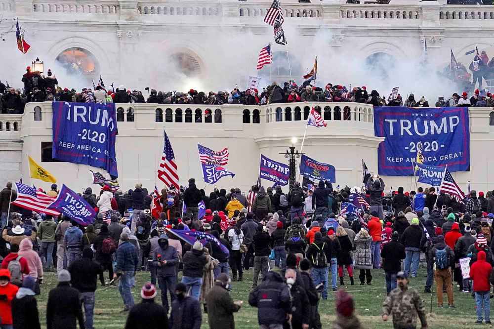 In this Wednesday, Jan. 6, 2021, file photo, violent rioters supporting President Donald Trump, storm the Capitol in Washington. (AP Photo/John Minchillo, File)