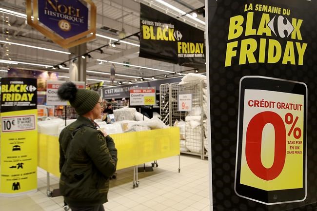 A customer walks down the aisle of a shop in the Carrefour Shopping center at the eve of the Black Friday event, in Cesson, western France, Thursday, Nov. 28, 2019. Some French lawmakers are considering banning Black Friday, the post-Thanksgiving sales event that has morphed into a global phenomenon. A legislative committee passed an amendment Monday that proposes prohibiting Black Friday since it causes