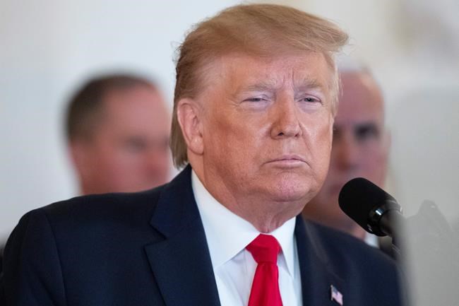 President Donald Trump addresses the nation from the White House on the ballistic missile strike that Iran launched against Iraqi air bases housing U.S. troops, Wednesday, Jan. 8, 2020, in Washington, accompanied by Vice President Mike Pence, and others. (AP Photo/Alex Brandon)