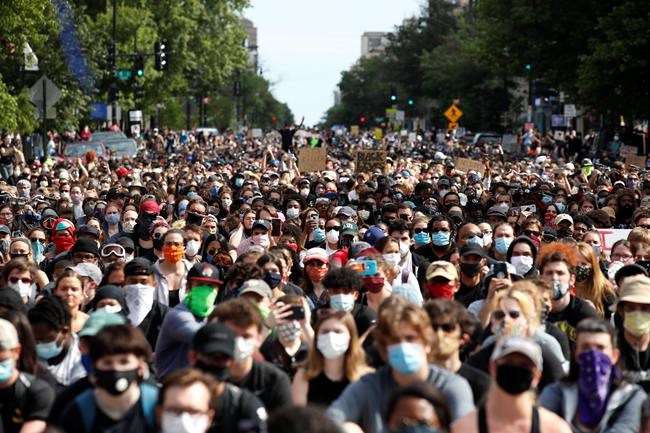Demonstrators march as they protest the death of George Floyd, Tuesday, June 2, 2020, in Washington. Floyd died after being restrained by Minneapolis police officers. (AP Photo/Alex Brandon)