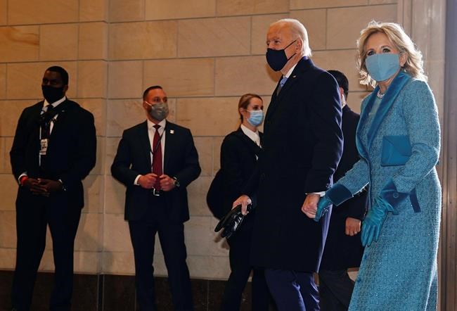 President-elect Joe Biden and his wife Jill Biden arrive at the East Front of the U.S. Capitol ahead of Biden’s inauguration, Wednesday, Jan. 20, 2021, at the U.S. Capitol in Washington. ((Jim Lo Scalzo/Pool Photo via AP)