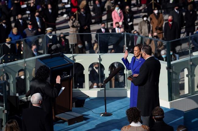 Kamala Harris is sworn in as vice president by Supreme Court Justice Sonia Sotomayor as her husband Doug Emhoff holds the Bible during the 59th Presidential Inauguration at the U.S. Capitol in Washington, Wednesday, Jan. 20, 2021. (Caroline Brehman/Pool Photo via AP)