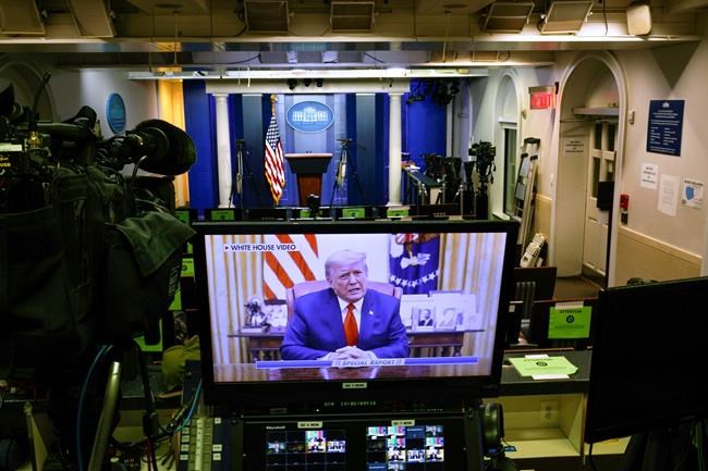 A video released by the White House, President Donald Trump shows a Twitter video on a television monitor in an empty press briefing room at the White House in Washington, after the U.S. House impeached him, Wednesday, Jan. 13, 2021. The pre-recorded video was being broadcast by Fox News. (AP Photo/Gerald Herbert )