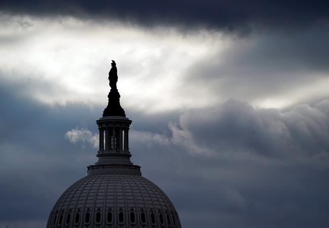 The bronze Statue of Freedom, by Thomas Crawford, is the crowning feature of the dome of the U.S. Capitol, shown ahead of the inauguration of President-elect Joe Biden and Vice President-elect Kamala Harris, Sunday, Jan. 17, 2021, in Washington. (AP Photo/Julio Cortez)
