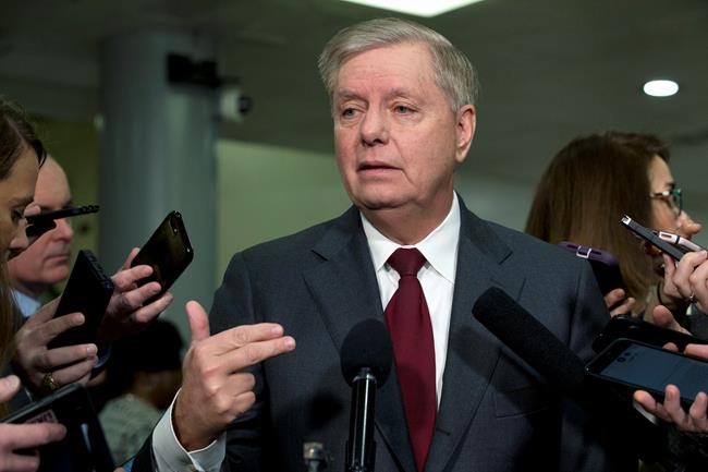 Sen. Lindsey Graham, R-S.C., speaks to the media before attending the impeachment trial of President Donald Trump, Thursday, Jan. 23, 2020, on Capitol Hill in Washington. (AP Photo/Jose Luis Magana)