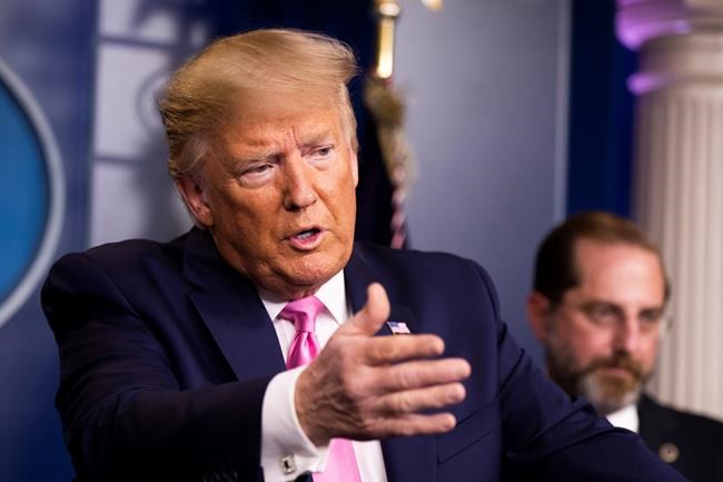 President Donald Trump with Department of Health and Human Services Secretary Alex Azar, right, and other members of the president's coronavirus task force speaks during a news conference at the Brady press briefing room of the White House, Wednesday, Feb. 26, 2020, in Washington. (AP Photo/Manuel Balce Ceneta)