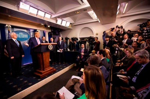 President Donald Trump with Vice President Mike Pence, left, and members of the president's coronavirus task force speaks during a news conference at the Brady press briefing room of the White House, Wednesday, Feb. 26, 2020, in Washington. (AP Photo/Manuel Balce Ceneta)