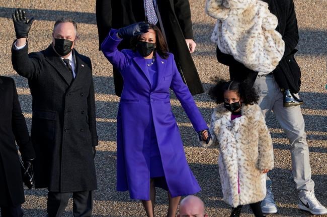 Vice President Kamala Harris and her husband Doug Emhoff walk in the parade during the Presidential Escort, part of Inauguration Day ceremonies, Wednesday, Jan. 20, 2021, in Washington. (AP Photo/David J. Phillip)