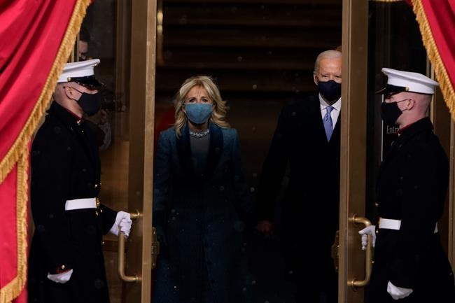 President-elect Joe Biden and his wife Jill, walk out for the 59th Presidential Inauguration at the U.S. Capitol in Washington, Wednesday, Jan. 20, 2021.(AP Photo/Patrick Semansky, Pool)