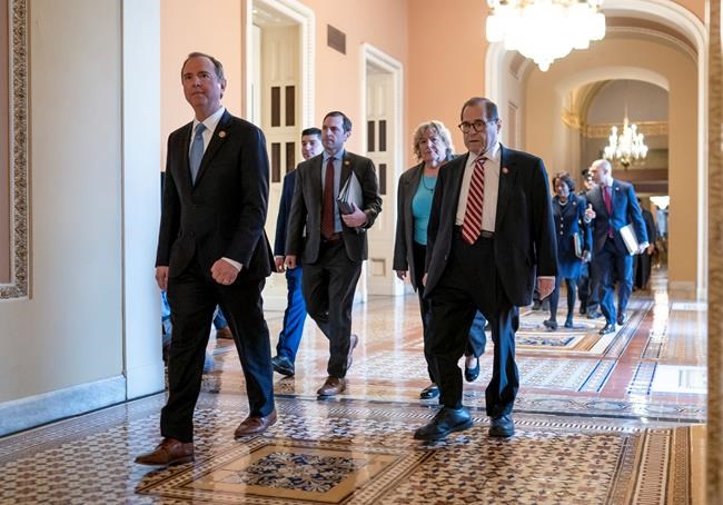 House Democratic impeachment managers, from left, House Intelligence Committee Chairman Adam Schiff, D-Calif., Rep. Jason Crow, D-Colo., Rep. Zoe Lofgren, D-Calif., and House Judiciary Committee Chairman Jerrold Nadler, D-N.Y., arrive for the start of the third day of the impeachment trial of President Donald Trump on charges of abuse of power and obstruction of Congress, at the Capitol in Washington, Thursday, Jan. 23, 2020. (AP Photo/J. Scott Applewhite)