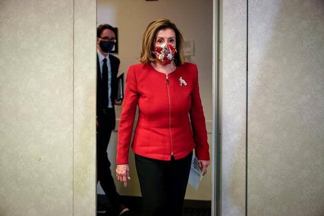 Speaker of the House Nancy Pelosi, D-Calif., arrives to talk to reporters about Election Day results in races for the House of Representatives, at Democratic National Committee headquarters in Washington, Tuesday, Nov. 3, 2020. (AP Photo/J. Scott Applewhite, Pool)