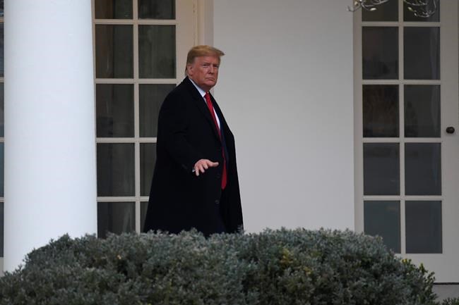 President Donald Trump walks along the colonnade of the White House in Washington, Monday, Jan. 13, 2020. Trump is heading to New Orleans, to attend the College Football Playoff National Championship between Louisiana State University and Clemson. (AP Photo/Susan Walsh)