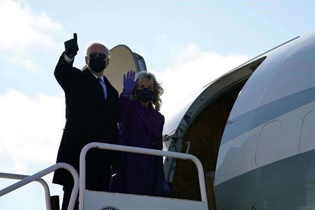 President-elect Joe Biden and his wife Jill Biden board a plane at New Castle Airport, Tuesday, Jan. 19, 2021, in New Castle, Del. (AP Photo/Evan Vucci)