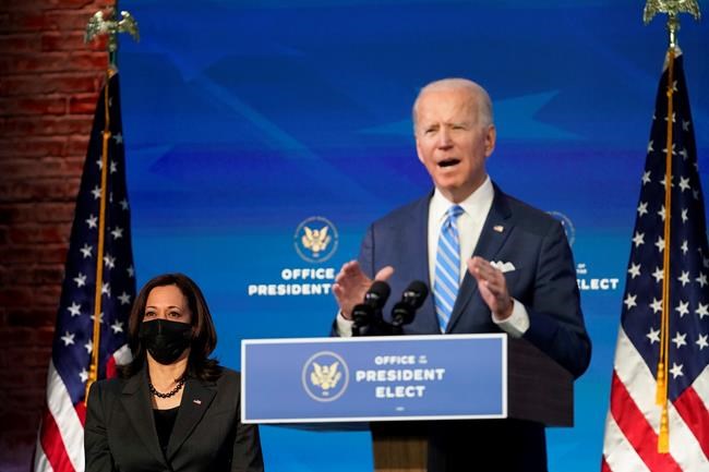 President-elect Joe Biden speaks about the COVID-19 pandemic during an event at The Queen theater, Thursday, Jan. 14, 2021, in Wilmington, Del., as Vice President-elect Kamala Harris listens. (AP Photo/Matt Slocum)