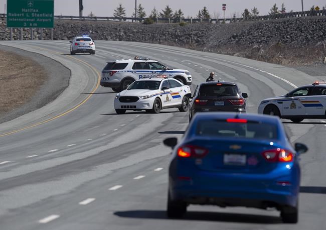 Police block the highway in Enfield, N.S. on Sunday, April 19, 2020. The Canadian Police Association says it?s extremely worrying how easy it is to impersonate a police office in Canada. THE CANADIAN PRESS/Andrew Vaughan
