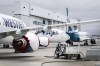 WestJet Boeing 737 Max aircraft are shown at the airline's facilities in Calgary, Alta., Tuesday, May 7, 2019. WestJet Airlines Ltd. has quietly changed its refund policy to allow some customers whose flights were cancelled due to the pandemic to reclaim their cash. THE CANADIAN PRESS/Jeff McIntosh