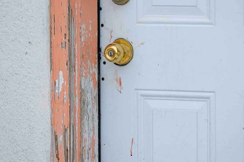 Blood smears on the door of one of the units at the Capri Motel. (Daniel Crump / Winnipeg Free Press)