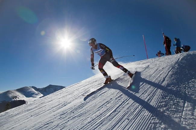 FILE - In this Nov. 7, 2013, file photo, Tommy Biesemeyer skis out of the high-speed training starting gate during a session of the U.S. Ski Team training center at Copper Mountain, Colo. Biesemeyer was just appointed the executive director of the World Cup Dreams Foundation, a nonprofit organization with the mission of reducing steep expenses for the next generation of Winter Games hopefuls. (AP Photo/Nathan Bilow, File)