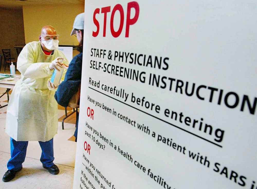 Kevin Frayer / THE CANADIAN PRESS FILES
The 2003 SARS outbreak took root in Toronto, killing 13 people in Canada, but eventually led to calls for more prevention, streamlined lab resources and a stronger role for health authorities.
