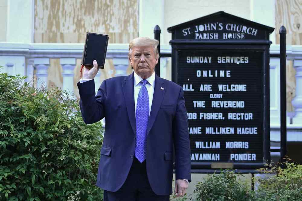 (Brendan Smialowski/AFP/Getty Images/TNS)
U.S. President Donald Trump holds up a Bible outside of St John's Episcopal church across Lafayette Park in Washington, D.C. on Monday.
