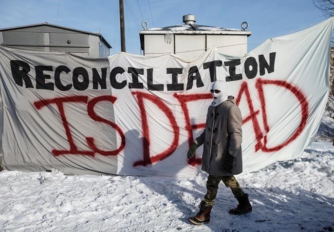 Supporters of the Wet'suwet'en who are against the LNG pipeline, block a CN Rail line just west of Edmonton on Wednesday February 19, 2020. THE CANADIAN PRESS/Jason Franson