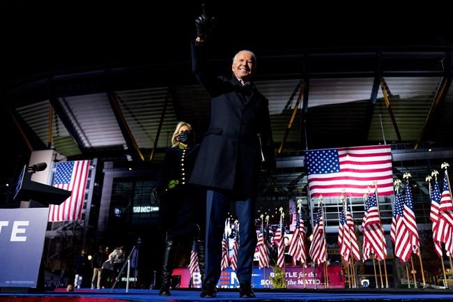 Jill Biden, the wife of Democratic presidential candidate former Vice President Joe Biden, comes on stage as he finishes speaking at a drive-In rally at Heinz Field in Pittsburgh, Monday, Nov. 2, 2020. Biden defeated President Donald Trump to become the 46th president of the United States on Saturday, Nov. 7, positioning himself to lead a nation gripped by historic pandemic and a confluence of economic and social turmoil. (AP Photo/Andrew Harnik)