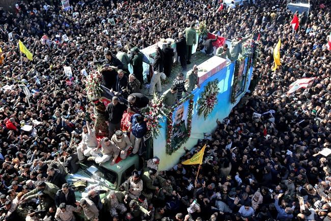 Coffins of Gen. Qassem Soleimani and others who were killed in Iraq by a U.S. drone strike, are carried on a truck surrounded by mourners during a funeral procession, in the city of Kerman, Iran, Tuesday, Jan. 7, 2020. A stampede erupted on Tuesday at a funeral procession for a top Iranian general killed in a U.S. airstrike last week, killing 35 people and injuring 48 others, state television reported. (AP Photo)