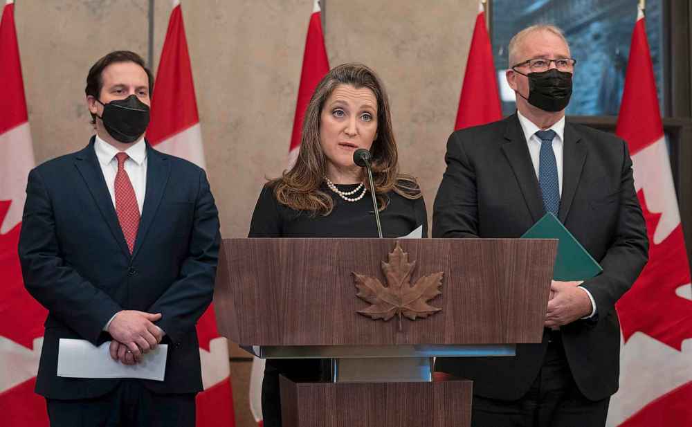 Public Safety Minister Marco Mendicino and President of the Queen's Privy Council for Canada and Emergency Preparedness Minister Bill Blair look on as Deputy Prime Minister and Finance Minister Chrystia Freeland speaks about the implementation of the Emergencies Act, Thursday, February 17, 2022 in Ottawa. (Adrian Wyld / The Canadian Press)