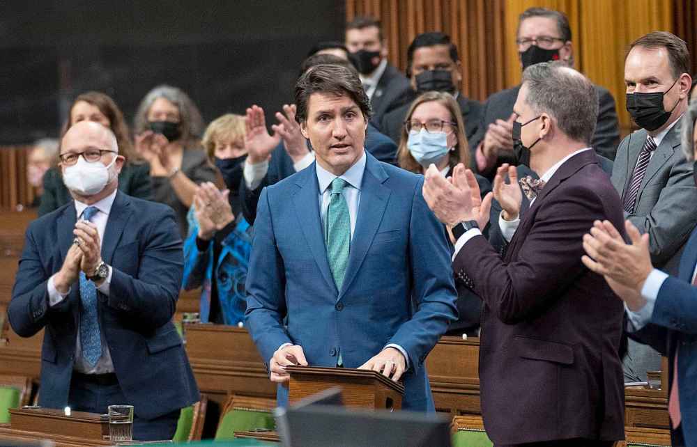 Prime Minister Justin Trudeau is applauded as he rises to speak about the implementation of the Emergencies Act, Thursday, February 17, 2022 in Ottawa. (Adrian Wyld / The Canadian Press)