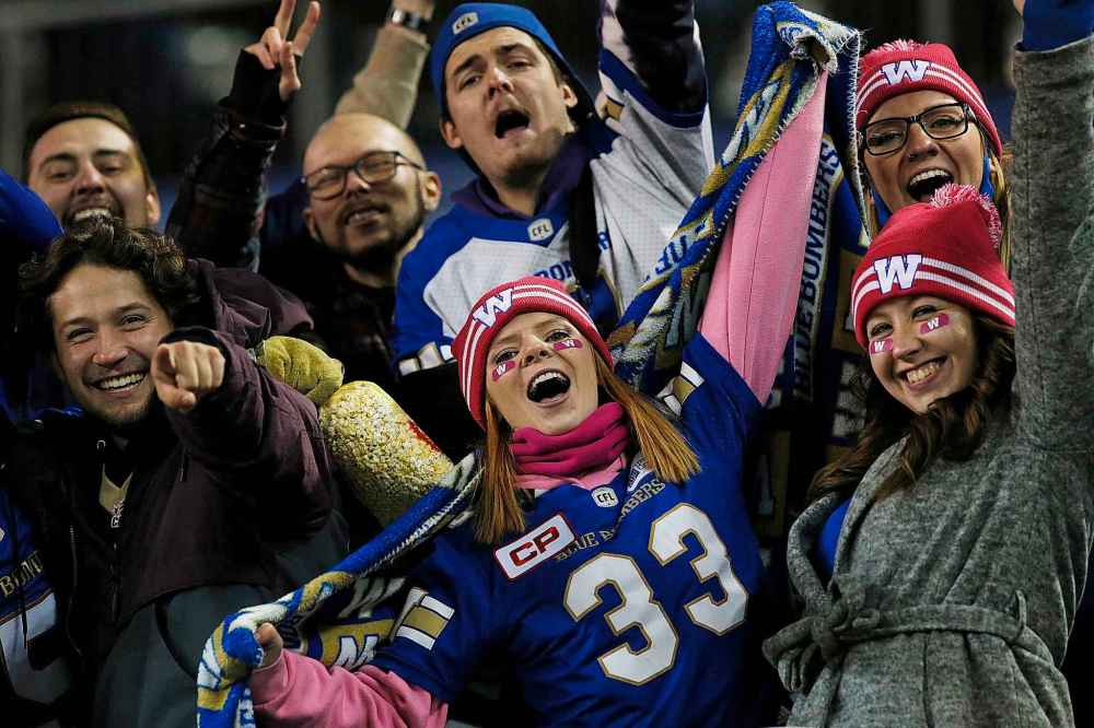 CP
Winnipeg Blue Bombers fans celebrate a win against the B.C. Lions. (John Woods / The Canadian Press)