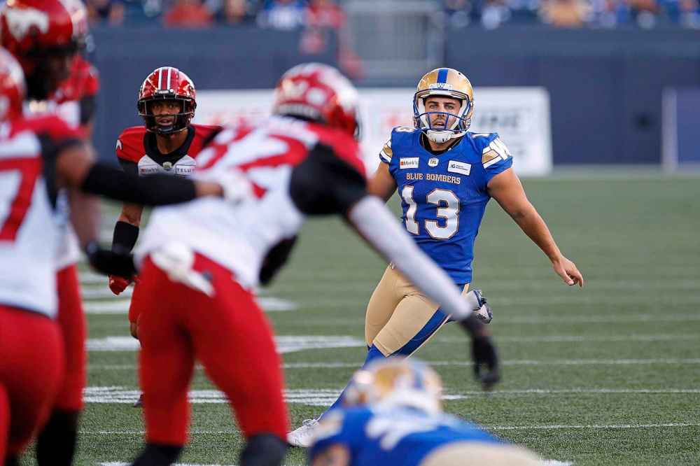 CP
Winnipeg Blue Bombers' kicker Marc Liegghio (13) chases down his missed field goal against the Calgary Stampeders during the first half. (John Woods / The Canadian Press)
