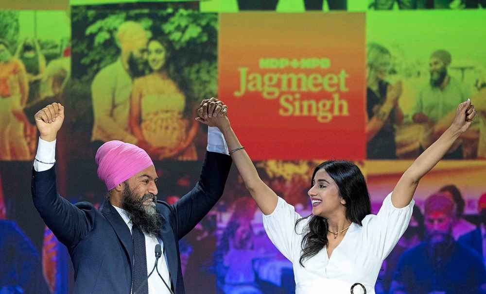 NDP Leader Jagmeet Singh and his wife Gurkiran Kaur Sidhu arrive on stage to deliver his concession speech at his election night headquarters during the Canadian federal election in Vancouver, Monday, September 20, 2021. THE CANADIAN PRESS/Jonathan Hayward