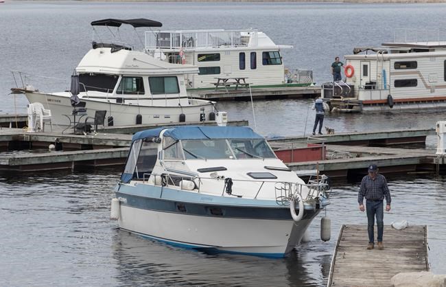 Boats get launched at Kawartha Lakes Marina in Bobcaygeon, Ont. on Saturday, May 16, 2020. THE CANADIAN PRESS/Fred Thornhill