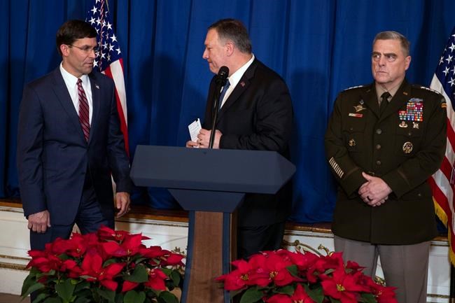 Secretary of State Mike Pompeo, center, Secretary of Defense Mark Esper, left, and Chairman of the Joint Chiefs of Staff Gen. Mark Milley deliver a statement on Iraq and Syria, at President Donald Trump's Mar-a-Lago property, Sunday, Dec. 29, 2019, in Palm Beach, Fla. (AP Photo/ Evan Vucci)