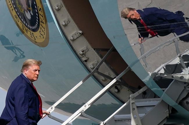 President Donald Trump boards Air Force One at Palm Beach International Airport, Thursday, Dec. 31, 2020, in West Palm Beach, Fla. Trump is returning to Washington after visiting his Mar-a-Lago resort. (AP Photo/Patrick Semansky)
