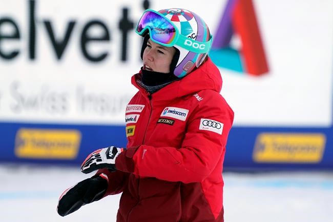 Switzerland's Michelle Gisin gets to the finish area after inspecting the women's super-G course, at the alpine ski World Championships in Cortina d'Ampezzo, Italy, Tuesday, Feb. 9, 2021. (AP Photo/Giovanni Auletta)