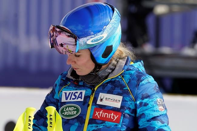 United States' Mikaela Shiffrin stands in the finish area after inspecting the women's super-G course, at the alpine ski World Championships in Cortina d'Ampezzo, Italy, Tuesday, Feb. 9, 2021. (AP Photo/Giovanni Auletta)