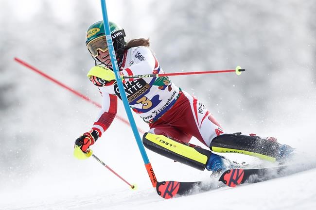 Austria's Katharina Liensberger speeds down the course during an alpine ski, women's World Cup slalom in Lenzerheide, Switzerland, Saturday, March 20, 2021. (AP Photo/Gabriele Facciotti)