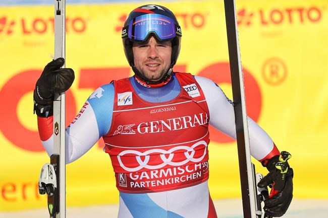 Switzerland's Beat Feuz gets to the finish area after completing an alpine ski, men's World Cup downhill, in Garmisch-Partenkirche, Germany, Saturday, Feb.1, 2020. (AP Photo/Alessandro Trovati)