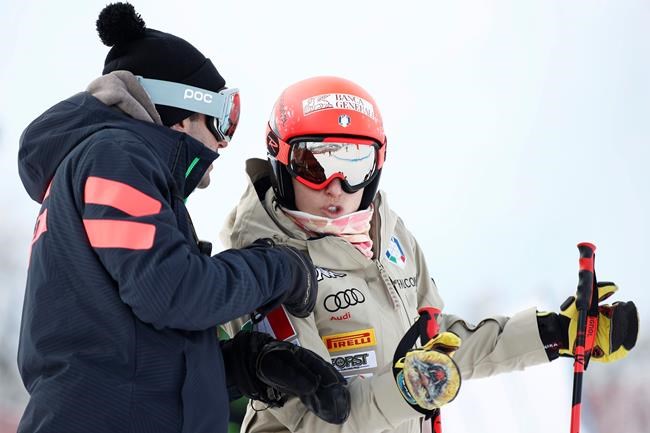 Italy's Federica Brignone, talks to her brother Davide as she inspects the course prior to the women's super-G, at the alpine ski World Championships in Cortina d'Ampezzo, Italy, Tuesday, Feb. 9, 2021. (AP Photo/Gabriele Facciotti)