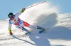 Switzerland's Gino Caviezel speeds down the course during an alpine ski, men's World Cup giant slalom in Soelden, Austria, Sunday, Oct. 18, 2020. (AP Photo/Giovanni Auletta)