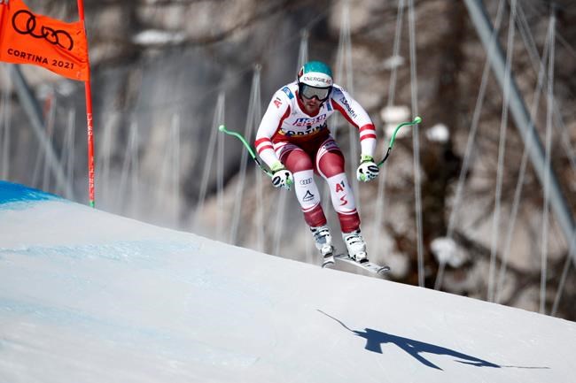 Austria's Vincent Kriechmayr speeds down the course during the men's downhill, at the alpine ski World Championships in Cortina d'Ampezzo, Italy, Sunday, Feb.14, 2021. (AP Photo/Gabriele Facciotti)