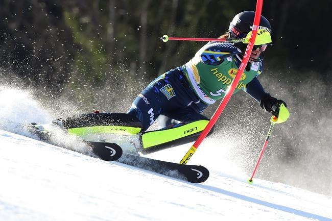 /Sweden's Anna Swenn Larsson speeds down the course during an alpine ski, women's World Cup slalom in Kranjska Gora, Slovenia, Sunday, Feb. 16, 2020. (AP Photo/Pier Marco Tacca)