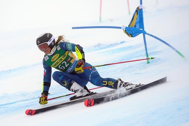 United States' Paula Moltzan speeds down the course during an alpine ski, women's World Cup giant slalom in Soelden, Austria, Saturday, Oct. 17, 2020. (AP Photo/Giovanni Auletta)