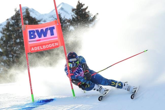 United States' Ted Ligety speeds down the course during an alpine ski, men's World Cup Giant slalom, in Adelboden, Switzerland, Saturday, Jan. 9, 2021. (AP Photo/Marco Tacca)
