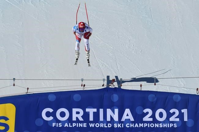 Switzerland's Beat Feuz competes during the men's downhill, at the alpine ski World Championships in Cortina d'Ampezzo, Italy, Sunday, Feb.14, 2021. (AP Photo/Marco Tacca)