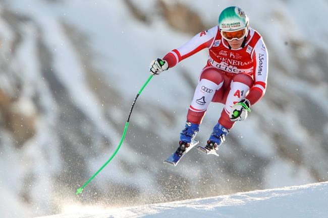 Austria's Otmar Striedinger speeds down the course during an alpine ski, men's World Cup downhill, in Val d'Isere, France, Sunday, Dec. 13, 2020. (AP Photo/Gabriele Facciotti)