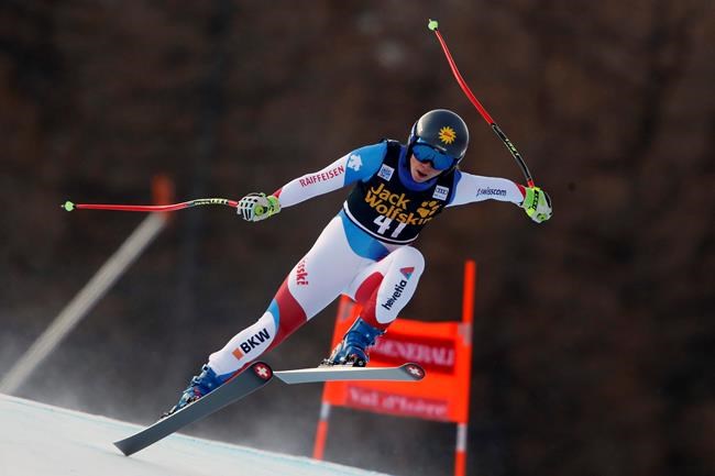 Switzerland's Jasmina Suter speeds down the course during an alpine ski, women's World Cup downhill, in Val d'Isere, France, Saturday, Dec.19, 2020. (AP Photo/Gabriele Facciotti)