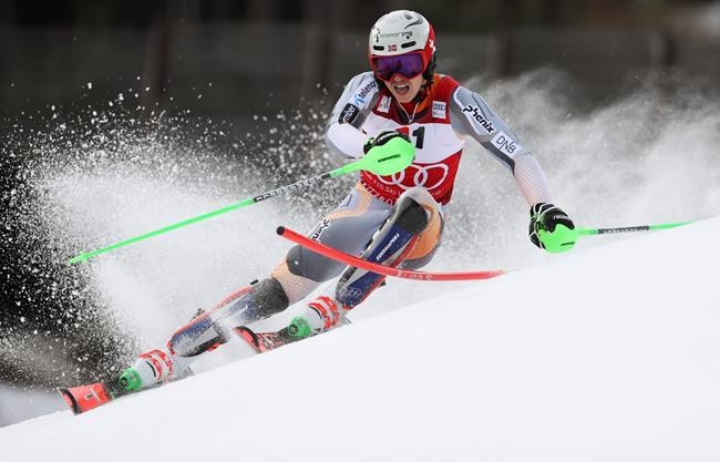 Norway's Henrik Kristoffersen speeds down the course during an alpine ski, men's World Cup slalom, in Kitzbuehel, Austria, Sunday, Jan. 26, 2020. (AP Photo/Alessandro Trovati)