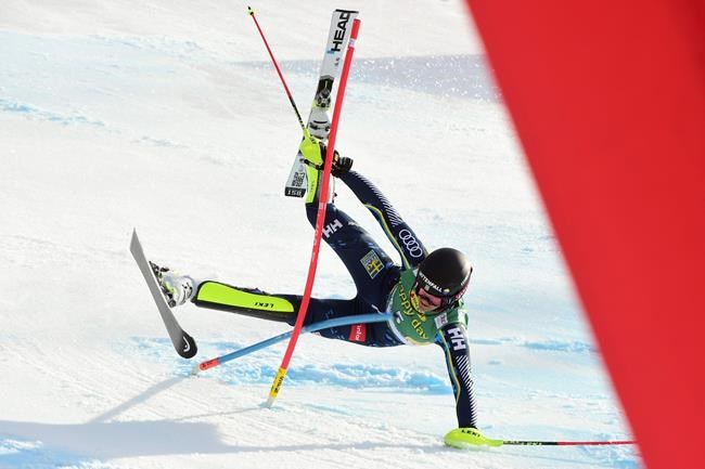 Sweden's Anna Swenn Larsson falls down during the second run of an alpine ski, women's World Cup slalom in Kranjska Gora, Slovenia, Sunday, Feb. 16, 2020. (AP Photo/Pier Marco Tacca)